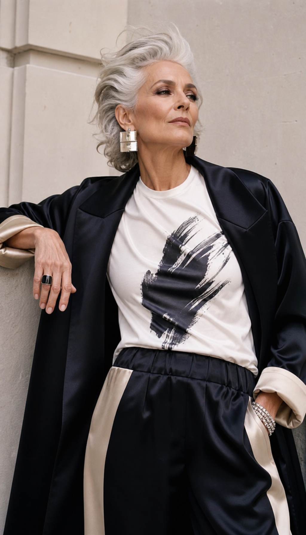 Stylish grandmother in a couture black coat and graphic T-shirt